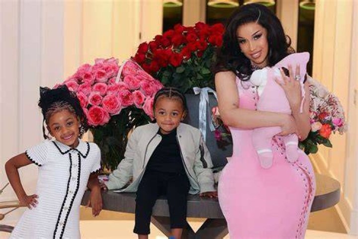 Cardi B flaunts her surgicallyenhanced figure in a petite black bra
